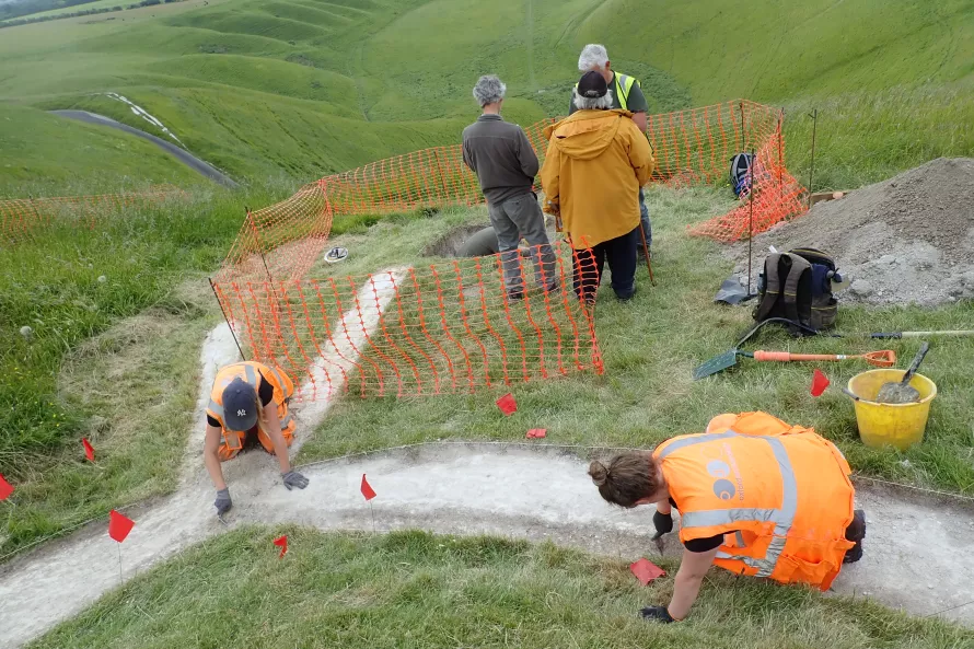 OA archaeologists working to enlarge some of the carvings to restore the Horse to its more visible size. 