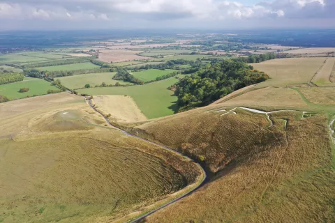 Aerial view of the White Horse with the Manger and Dragon Hill and the Vale of White Hoirse in the background. 