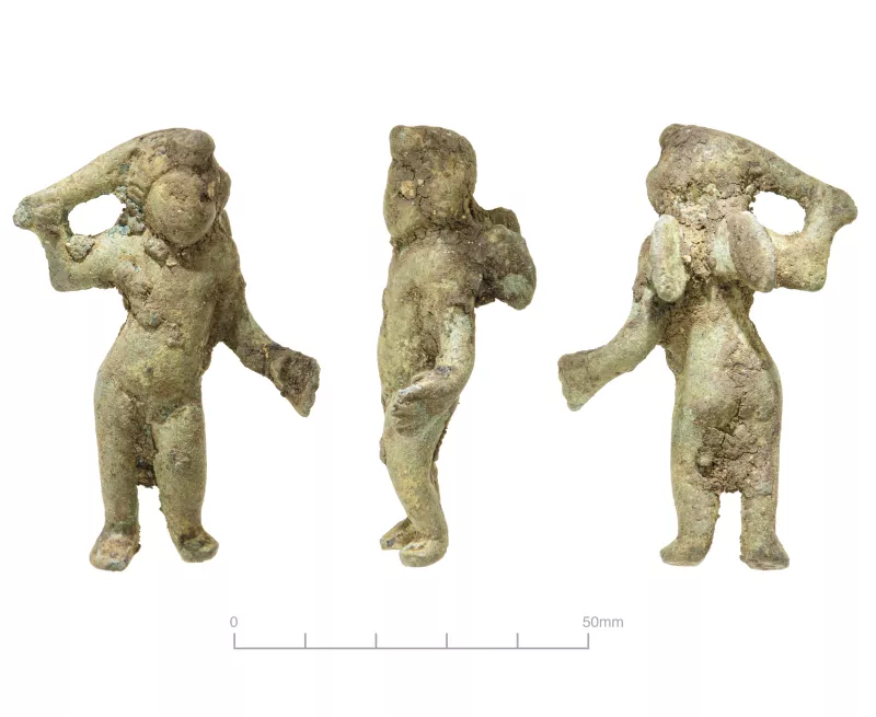 cupid figurine seen from three sides