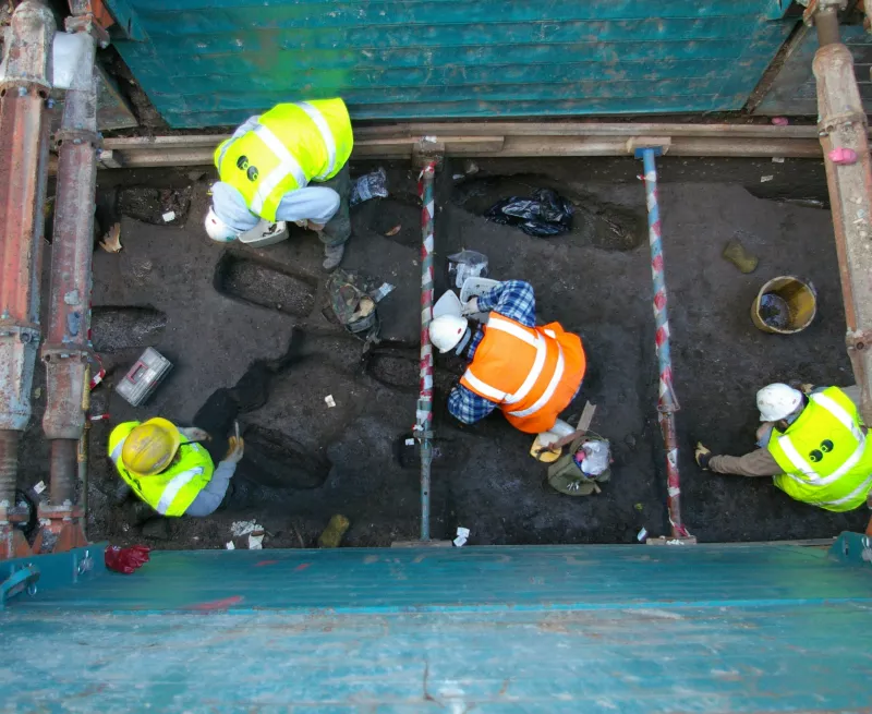 The OA team excavating post-medieval burials in St Hilda's churchyard, South Shields.