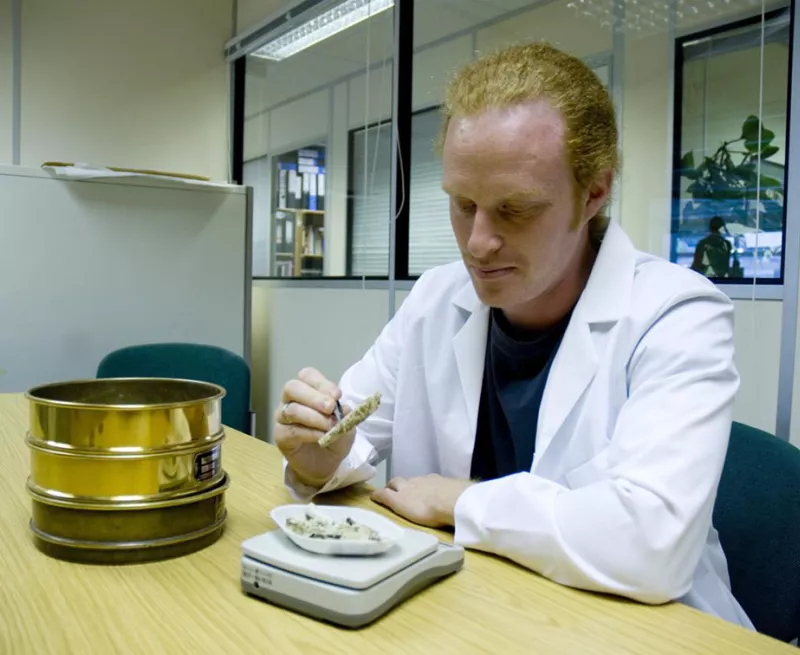 A member of the HBS team examining cremated bone. 