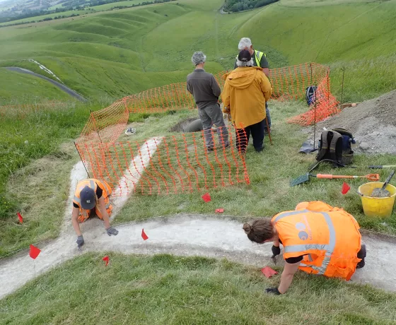 OA archaeologists working to enlarge some of the carvings to restore the Horse to its more visible size. 