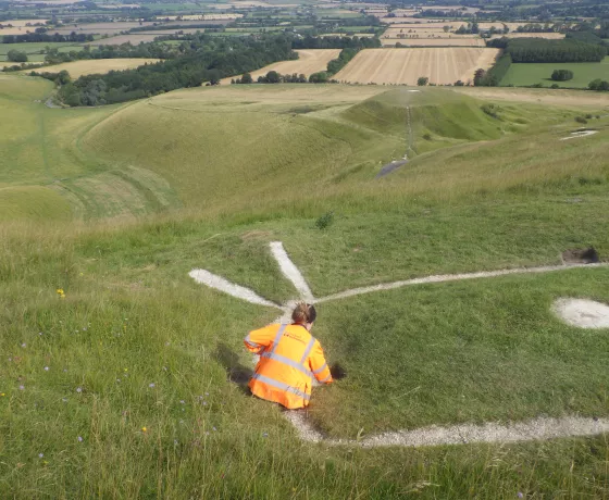 Our colleague Charlie preparing one of the excavation pits during investigations at the White Horse in 2023.